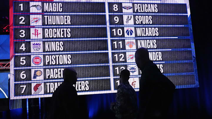 May 17, 2022; Chicago, IL, USA; People look at the draft lottery order after the 2022 NBA Draft