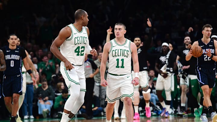 Apr 20, 2025; Boston, Massachusetts, USA; Boston Celtics guard Payton Pritchard (11) reacts towards center Al Horford (42) after making a three point basket during the first half against the Orlando Magic at TD Garden. Mandatory Credit: Bob DeChiara-Imagn Images