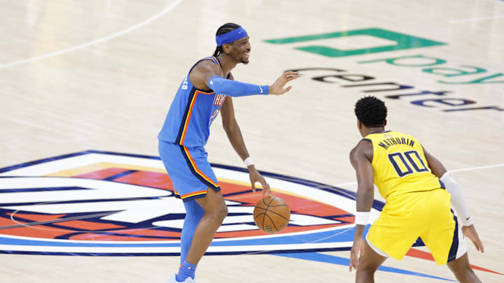 Jun 22, 2025; Oklahoma City, Oklahoma, USA; Oklahoma City Thunder guard Shai Gilgeous-Alexander (2) dribbles the ball against Indiana Pacers guard Bennedict Mathurin (00) during the second half of game seven of the 2025 NBA Finals at Paycom Center. Mandatory Credit: Alonzo Adams-Imagn Images Jun 22, 2025; Oklahoma City, Oklahoma, USA; Oklahoma City Thunder guard Shai Gilgeous-Alexander (2) dribbles the ball against Indiana Pacers guard Bennedict Mathurin (00) during the second half of game seven of the 2025 NBA Finals at Paycom Center. Mandatory Credit: Alonzo Adams-Imagn Images
