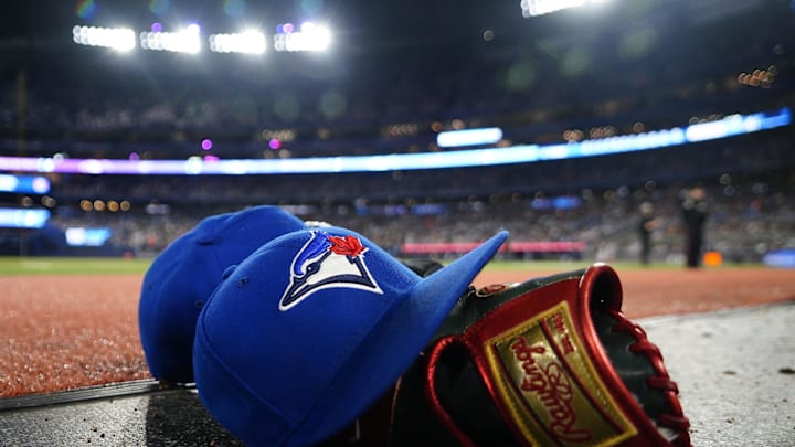 May 10, 2024; Toronto, Ontario, CAN; A pair of Toronto Blue Jays hats and glove in the dugout during a game against the Minnesota Twins at Rogers Centre. Mandatory Credit: John E. Sokolowski-Imagn Images May 10, 2024; Toronto, Ontario, CAN; A pair of Toronto Blue Jays hats and glove in the dugout during a game against the Minnesota Twins at Rogers Centre. Mandatory Credit: John E. Sokolowski-Imagn Images
