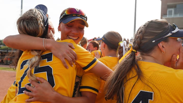The Michigan Wolverines celebrate Saturday, May 10, 2025, after the Big Ten softball tournament championship game against the UCLA Bruins at Purdue University’s Bittinger Stadium in West Lafayette, Indiana. Michigan Wolverines won 2-0.