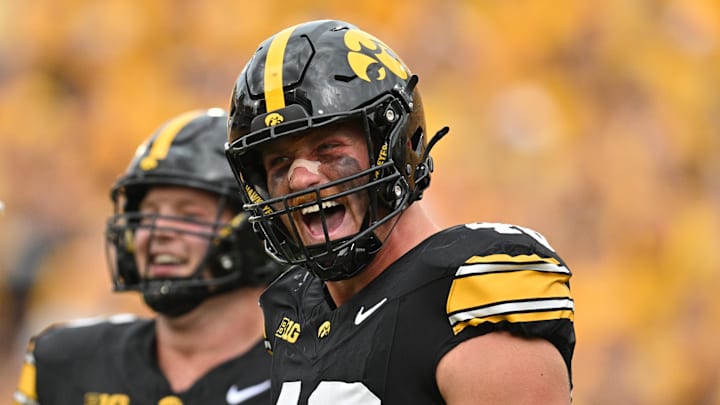 Sep 14, 2024; Iowa City, Iowa, USA; Iowa Hawkeyes defensive lineman Max Llewellyn (48) reacts after a sack during the third quarter against the Troy Trojans at Kinnick Stadium. Mandatory Credit: Jeffrey Becker-Imagn Images