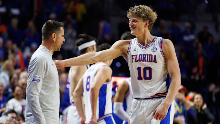 Feb 1, 2026; Gainesville, Florida, USA; Florida Gators head coach Todd Golden and Florida Gators forward Thomas Haugh (10) celebrate against the Alabama Crimson Tide during the second half at Exactech Arena at the Stephen C. O'Connell Center. Mandatory Credit: Matt Pendleton-Imagn Images