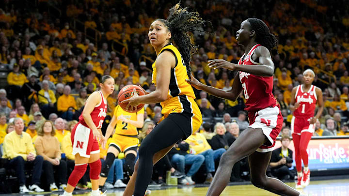 Iowa forward Hannah Stuelke (45) drives to the basket against Nebraska forward Eliza Maupin (21) Jan. 1, 2026 at Carver-Hawkeye Arena in Iowa City, Iowa.