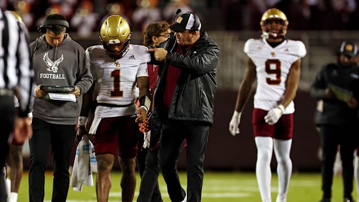 Oct 17, 2024; Blacksburg, Virginia, USA; Boston College Eagles head coach Bill O'Brien talks to quarterback Thomas Castellanos (1) during the second quarter against the Virginia Tech Hokies at Lane Stadium. Mandatory Credit: Peter Casey-Imagn Images