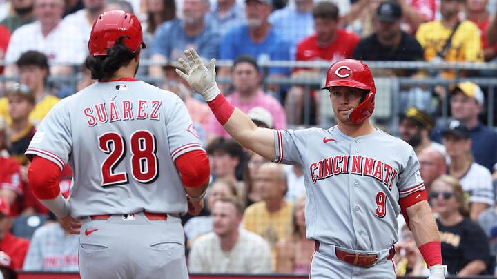 Jun 26, 2026; Pittsburgh, Pennsylvania, USA; Cincinnati Reds second baseman Matt McLain (9) greets third baseman Eugenio Suárez (28) crossing home plate to score a run against the Pittsburgh Pirates during the second inning at PNC Park. Mandatory Credit: Charles LeClaire-Imagn Images