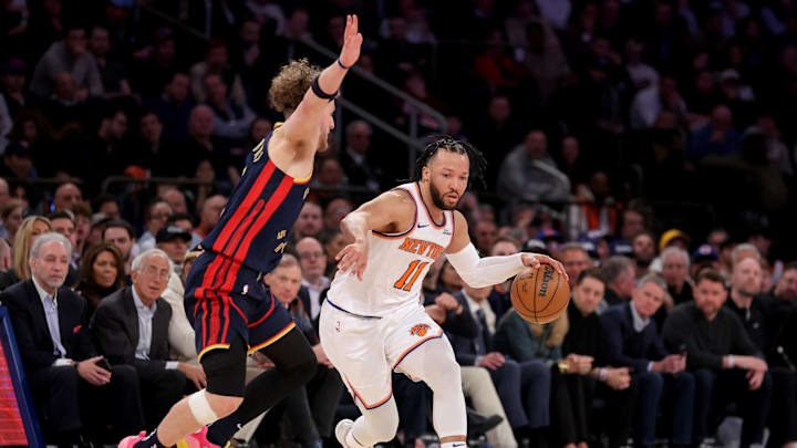 Mar 4, 2025; New York, New York, USA; New York Knicks guard Jalen Brunson (11) brings the ball up court against Golden State Warriors guard Brandin Podziemski (2) during the third quarter at Madison Square Garden. Mandatory Credit: Brad Penner-Imagn Images