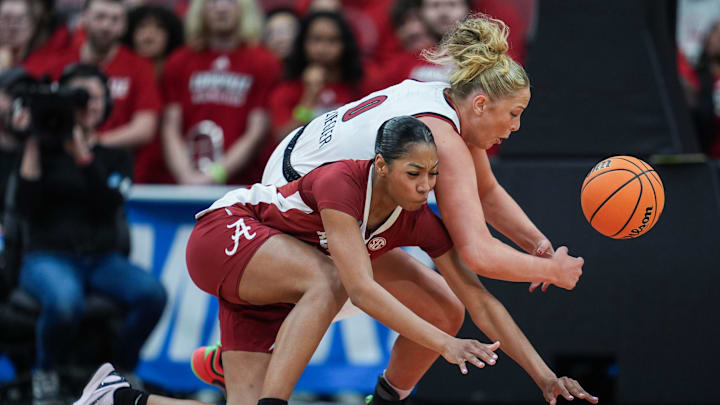 Louisville Cardinals forward Laura Ziegler (0) and Alabama Crimson Tide guard Ta'mia Scott (15) battle for a loose ball during the 2026 NCAA Women's March Madness basketball at the KFC Yum Center In Louisville, Kentucky. March 23, 2026.