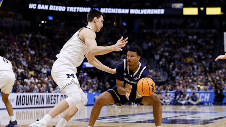March 20, 2025; Denver, CO, USA; UC San Diego Tritons guard Chris Howell (8) looks to pass the ball as Michigan Wolverines center Vladislav Goldin (50) defends during the first half at Ball Arena. Mandatory Credit: Isaiah J. Downing-Imagn Images March 20, 2025; Denver, CO, USA; UC San Diego Tritons guard Chris Howell (8) looks to pass the ball as Michigan Wolverines center Vladislav Goldin (50) defends during the first half at Ball Arena. Mandatory Credit: Isaiah J. Downing-Imagn Images