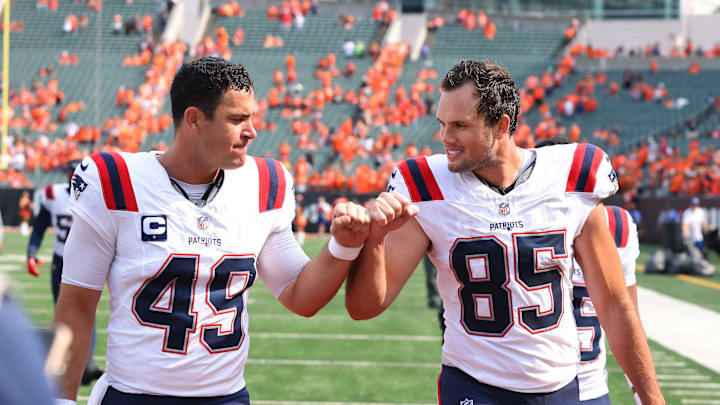 Sep 8, 2024; Cincinnati, Ohio, USA; New England Patriots tight end Hunter Henry (85) and long snapper Joe Cardona (49) celebrate following the win over the Cincinnati Bengals at Paycor Stadium. Mandatory Credit: Joseph Maiorana-Imagn Images