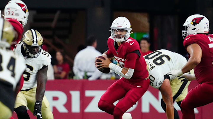 Cardinals quarterback Desmond Ridder (19) scrambles against the Saints defensive lineman Bryan Bresee (90) during a game at State Farm Stadium in Glendale on Saturday, Aug. 10, 2024. Cardinals quarterback Desmond Ridder (19) scrambles against the Saints defensive lineman Bryan Bresee (90) during a game at State Farm Stadium in Glendale on Saturday, Aug. 10, 2024.