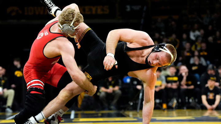 Iowa’s Patrick Kennedy is taken to the mat by Ohio State’s Carson Kharchla in a 174-pound match during a Big Ten conference dual Saturday, Jan. 25, 2025 at Carver-Hawkeye Arena in Iowa City, Iowa. Iowa’s Patrick Kennedy is taken to the mat by Ohio State’s Carson Kharchla in a 174-pound match during a Big Ten conference dual Saturday, Jan. 25, 2025 at Carver-Hawkeye Arena in Iowa City, Iowa.