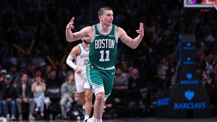 Nov 13, 2024; Brooklyn, New York, USA; Boston Celtics guard Payton Pritchard (11) reacts after making a three point basket during the second half against the Brooklyn Nets at Barclays Center. Mandatory Credit: Vincent Carchietta-Imagn Images