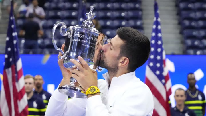 Sep 10, 2023; Flushing, NY, USA; Novak Djokovic of Serbia celebrates with the championship trophy after his match against Daniil Medvedev (not pictured) in the men's singles final on day fourteen of the 2023 U.S. Open tennis tournament at USTA Billie Jean King National Tennis Center. Sep 10, 2023; Flushing, NY, USA; Novak Djokovic of Serbia celebrates with the championship trophy after his match against Daniil Medvedev (not pictured) in the men's singles final on day fourteen of the 2023 U.S. Open tennis tournament at USTA Billie Jean King National Tennis Center.
