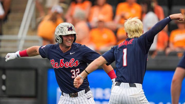 Ole Miss outfielder Tristan Bissetta and Ole Miss infielder Brayden Randle celebrate after Bissetta hits a grand slam 