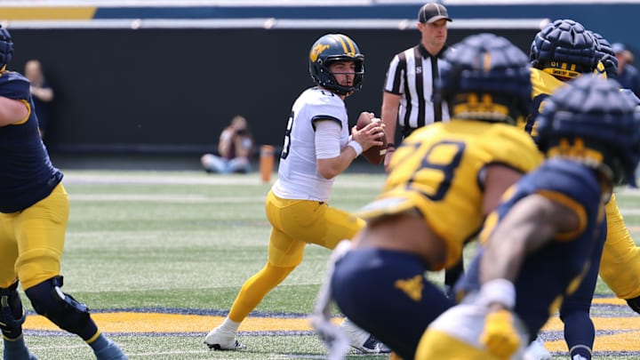 West Virginia University redshirt sophomore quarterback Nicco Marchiol looks downfield during the 2024 Gold-Blue Spring Game. West Virginia University redshirt sophomore quarterback Nicco Marchiol looks downfield during the 2024 Gold-Blue Spring Game.