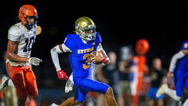 Cardinal Newman wide receiver Naeshaun Montgomery runs down the field against Benjamin in their