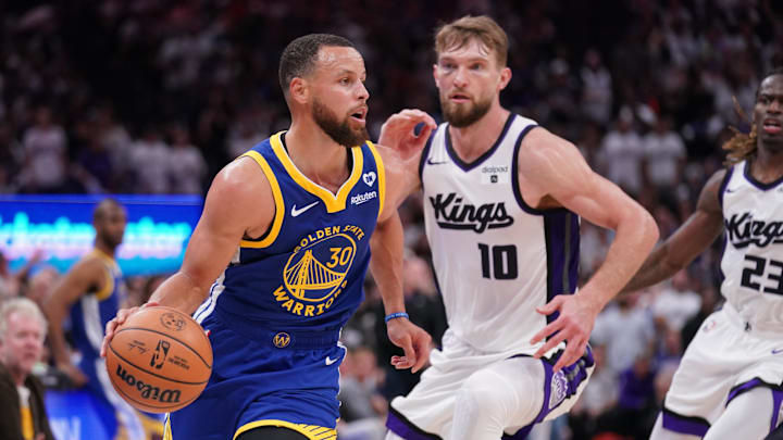 Apr 16, 2024; Sacramento, California, USA; Golden State Warriors guard Stephen Curry (30) dribbles the ball in front of Sacramento Kings forward Domantas Sabonis (10) in the fourth quarter during a play-in game of the 2024 NBA playoffs at the Golden 1 Center. Mandatory Credit: Cary Edmondson-Imagn Images