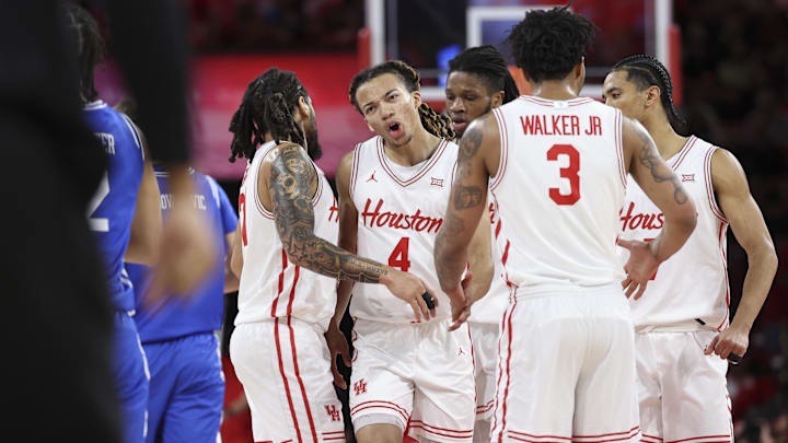 Dec 29, 2025; Houston, Texas, USA; Houston Cougars guard Kingston Flemings (4) reacts with teammates after a play during the second half against the Middle Tennessee Blue Raiders at Fertitta Center. Mandatory Credit: Troy Taormina-Imagn Images