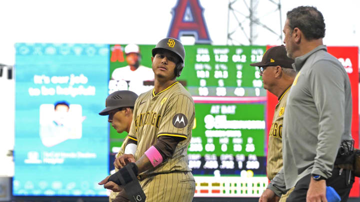 Jun 5, 2024; Anaheim, California, USA; San Diego Padres third baseman Manny Machado (13) leaves the game with an injury in the fourth inning at Angel Stadium. Mandatory Credit: Jayne Kamin-Oncea-USA TODAY Sports Jun 5, 2024; Anaheim, California, USA; San Diego Padres third baseman Manny Machado (13) leaves the game with an injury in the fourth inning at Angel Stadium. Mandatory Credit: Jayne Kamin-Oncea-USA TODAY Sports