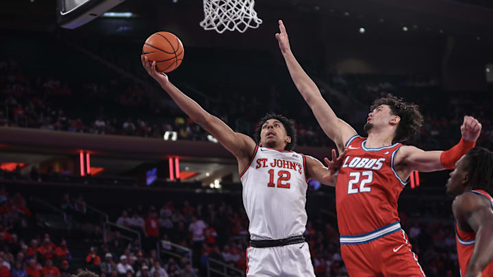 Nov 17, 2024; New York, New York, USA; St. John's Red Storm guard RJ Luis Jr. (12) drives past New Mexico Lobos forward Mustapha Amzil (22) for a layup in the second half at Madison Square Garden. Mandatory Credit: Wendell Cruz-Imagn Images Nov 17, 2024; New York, New York, USA; St. John's Red Storm guard RJ Luis Jr. (12) drives past New Mexico Lobos forward Mustapha Amzil (22) for a layup in the second half at Madison Square Garden. Mandatory Credit: Wendell Cruz-Imagn Images