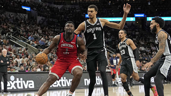 Feb 2, 2024; San Antonio, Texas, USA; New Orleans Pelicans forward Zion Williamson (1) drives to the basket while defended by San Antonio Spurs forward Victor Wembanyama (1) during the first half at Frost Bank Center. Mandatory Credit: Scott Wachter-Imagn Images