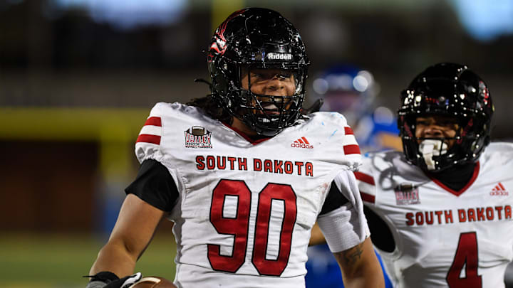 South Dakota Coyote defense line Mi’Quise Grace (90) celebrates getting the touchdown on Saturday, Oct. 26, 2024, at Dana J. Dykhouse Stadium in Brookings, South Dakota.