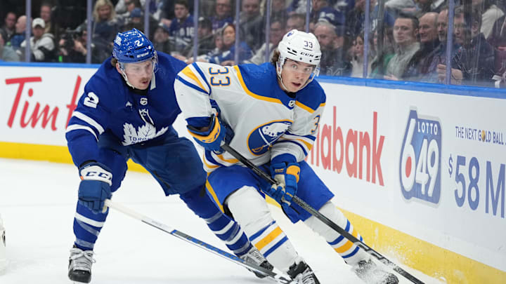 Mar 6, 2024; Toronto, Ontario, CAN; Buffalo Sabres defenseman Ryan Johnson (33) battles for the puck