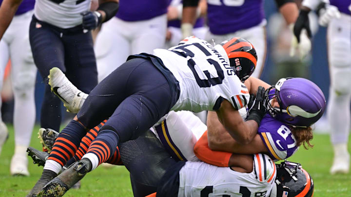 Nov 24, 2024; Chicago, Illinois, USA; Minnesota Vikings tight end T.J. Hockenson (87) is tacked after a reception by Chicago Bears linebacker T.J. Edwards (53) and free safety Kevin Byard (31) during the third quarter at Soldier Field. Mandatory Credit: Daniel Bartel-Imagn Images