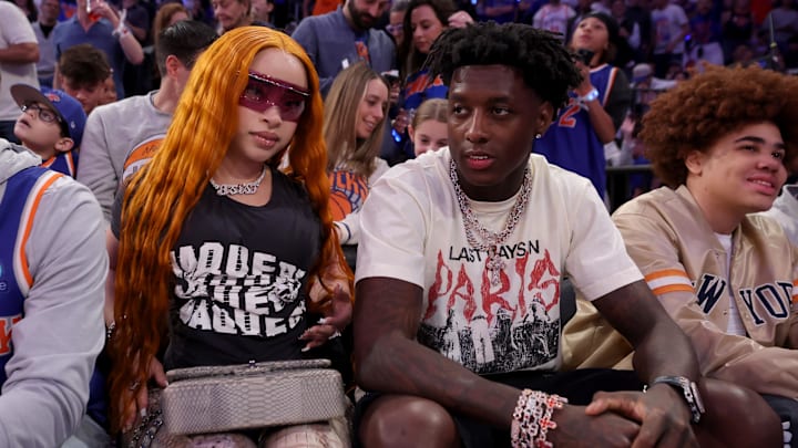 May 16, 2025; New York, New York, USA; American rapper Ice Spice (left) sits courtside with New York Jets player Sauce Gardner during the fourth quarter of game six in the second round of the 2025 NBA Playoffs between the New York Knicks and the Boston Celtics at Madison Square Garden. Mandatory Credit: Brad Penner-Imagn Images
