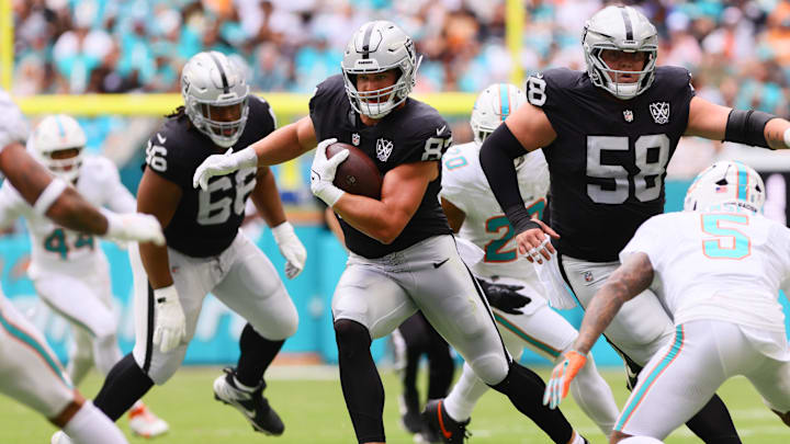 Nov 17, 2024; Miami Gardens, Florida, USA; Las Vegas Raiders tight end Michael Mayer (87) runs with the football against the Miami Dolphins during the first quarter at Hard Rock Stadium. Mandatory Credit: Sam Navarro-Imagn Images