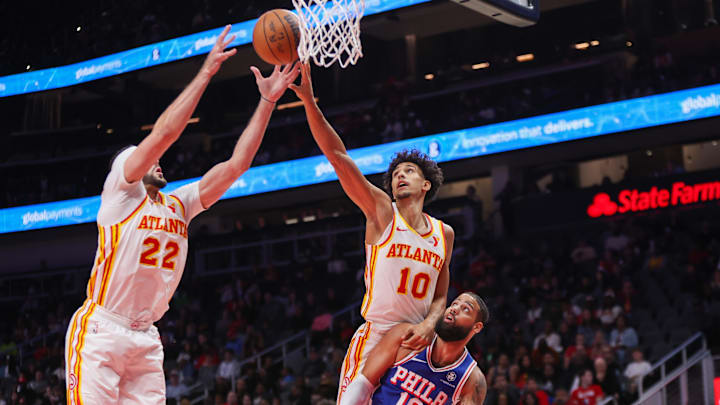 Oct 14, 2024; Atlanta, Georgia, USA; Atlanta Hawks forward Larry Nance Jr. (22) and forward Zaccharie Risacher (10) go up for a rebound over Philadelphia 76ers forward Caleb Martin (16) in the first quarter at State Farm Arena. Mandatory Credit: Brett Davis-Imagn Images Oct 14, 2024; Atlanta, Georgia, USA; Atlanta Hawks forward Larry Nance Jr. (22) and forward Zaccharie Risacher (10) go up for a rebound over Philadelphia 76ers forward Caleb Martin (16) in the first quarter at State Farm Arena. Mandatory Credit: Brett Davis-Imagn Images