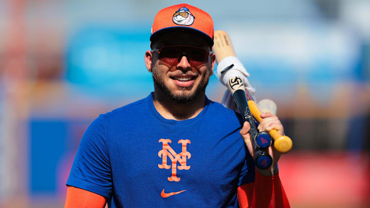 Feb 15, 2025; Port St. Lucie, FL, USA; New York Mets catcher Francisco Alvarez (4) arrives for batting practice during a spring training workout at Clover Park. Mandatory Credit: Sam Navarro-Imagn Images
