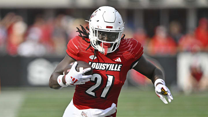 Sep 21, 2024; Louisville, Kentucky, USA;  Louisville Cardinals running back Donald Chaney (21) runs the ball against the Georgia Tech Yellow Jackets during the first half at L&N Federal Credit Union Stadium. Mandatory Credit: Jamie Rhodes-Imagn Images