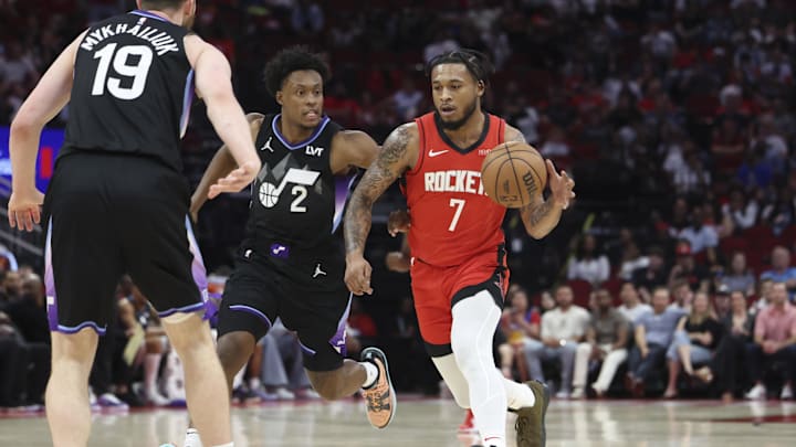 Apr 2, 2025; Houston, Texas, USA; Houston Rockets forward Cam Whitmore (7) dribbles the ball as Utah Jazz guard Collin Sexton (2) defends during the fourth quarter at Toyota Center. Mandatory Credit: Troy Taormina-Imagn Images