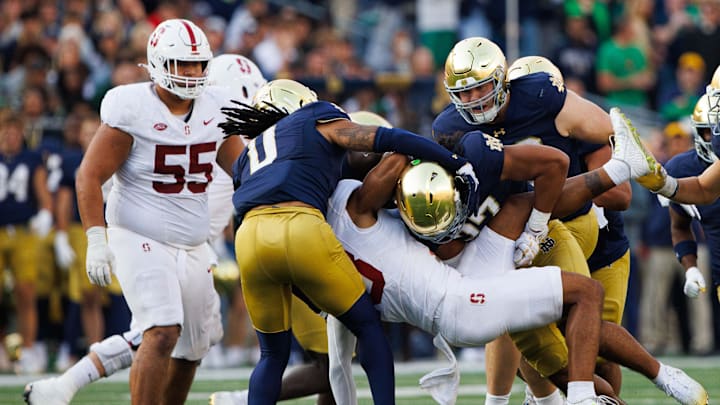 Notre Dame linebacker Kyngstonn Viliamu-Asa (27) tackles Stanford wide receiver Elic Ayomanor (13) during a NCAA college football game between Notre Dame and Stanford at Notre Dame Stadium on Saturday, Oct. 12, 2024, in South Bend. Notre Dame linebacker Kyngstonn Viliamu-Asa (27) tackles Stanford wide receiver Elic Ayomanor (13) during a NCAA college football game between Notre Dame and Stanford at Notre Dame Stadium on Saturday, Oct. 12, 2024, in South Bend.