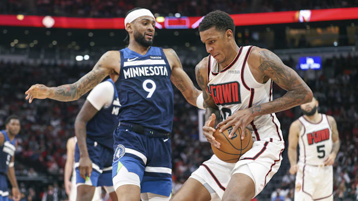 Dec 27, 2024; Houston, Texas, USA; Houston Rockets forward Jabari Smith Jr. (10) attempts to control the ball as Minnesota Timberwolves guard Nickeil Alexander-Walker (9) defends during the fourth quarter at Toyota Center. Mandatory Credit: Troy Taormina-Imagn Images Dec 27, 2024; Houston, Texas, USA; Houston Rockets forward Jabari Smith Jr. (10) attempts to control the ball as Minnesota Timberwolves guard Nickeil Alexander-Walker (9) defends during the fourth quarter at Toyota Center. Mandatory Credit: Troy Taormina-Imagn Images