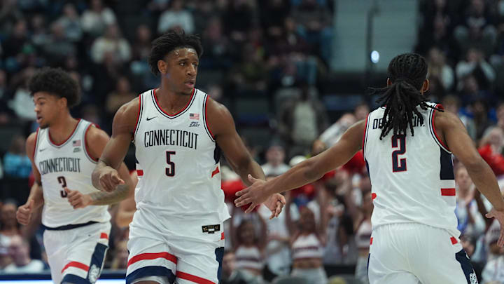 Feb 3, 2026; Hartford, Connecticut, USA; UConn Huskies forward Tarris Reed Jr. (5) reacts with guard Silas Demary Jr. (2) as they take on the Xavier Musketeers in the first half at PeoplesBank Arena. Mandatory Credit: David Butler II-Imagn Images