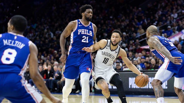 Jan 25, 2023; Philadelphia, Pennsylvania, USA; Brooklyn Nets guard Ben Simmons (10) dribbles the ball in front of Philadelphia 76ers center Joel Embiid (21) during the first quarter at Wells Fargo Center. Mandatory Credit: Bill Streicher-Imagn Images