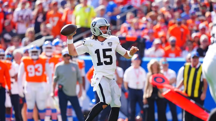 Oct 6, 2024; Denver, Colorado, USA; Las Vegas Raiders quarterback Gardner Minshew (15) prepares to pass in the second quarter against the Denver Broncos at Empower Field at Mile High. Mandatory Credit: Ron Chenoy-Imagn Images