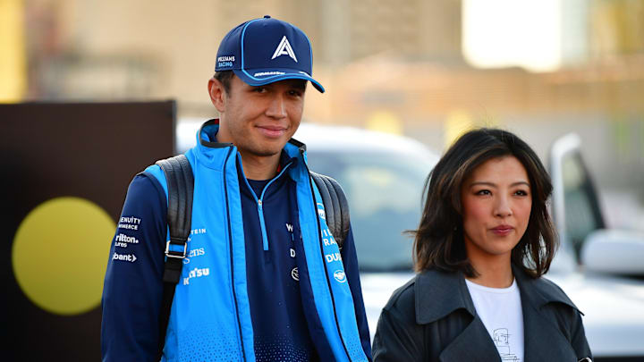 Nov 21, 2024; Las Vegas, Nevada, USA; Williams Racing driver Alex Albon (23) arrives before practice with girlfriend Lily Muni for the Las Vegas Grand Prix at Las Vegas Circuit. Mandatory Credit: Gary A. Vasquez-Imagn Images