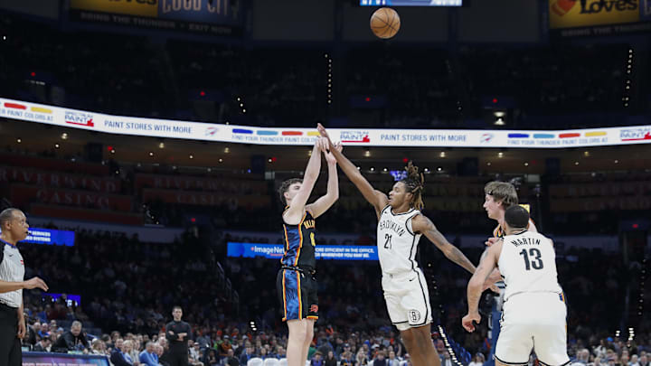 Jan 19, 2025; Oklahoma City, Oklahoma, USA; Oklahoma City Thunder guard Alex Ducas (88) attempts a three point basket as Brooklyn Nets forward Noah Clowney (21) defends during the second half at Paycom Center. Mandatory Credit: Alonzo Adams-Imagn Images