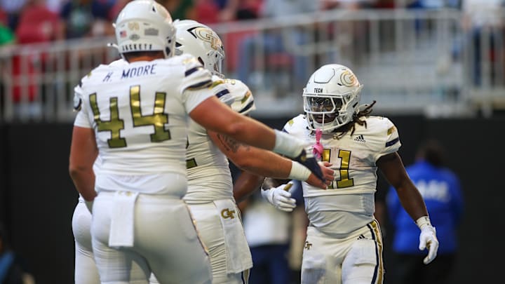 Oct 19, 2024; Atlanta, Georgia, USA; Georgia Tech Yellow Jackets running back Jamal Haynes (11) celebrates with teammates after scoring a touchdown against the Notre Dame Fighting Irish in the first quarter at Mercedes-Benz Stadium. Mandatory Credit: Brett Davis-Imagn Images