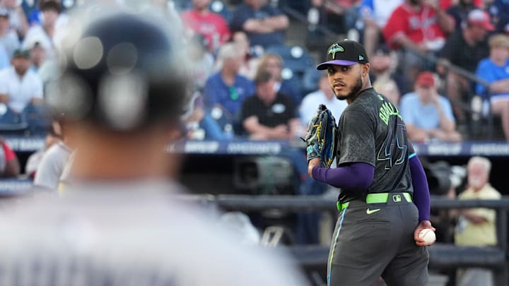 Tampa Bay pitcher Taj Bradley (45) checks the Atlanta Braves runner at first base during Friday's game. 