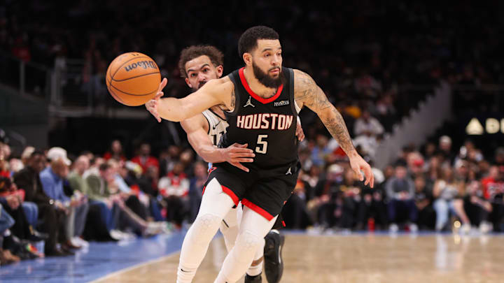 Jan 28, 2025; Atlanta, Georgia, USA; Atlanta Hawks guard Trae Young (11) strips the ball from Houston Rockets guard Fred VanVleet (5) in the third quarter at State Farm Arena. Mandatory Credit: Brett Davis-Imagn Images
