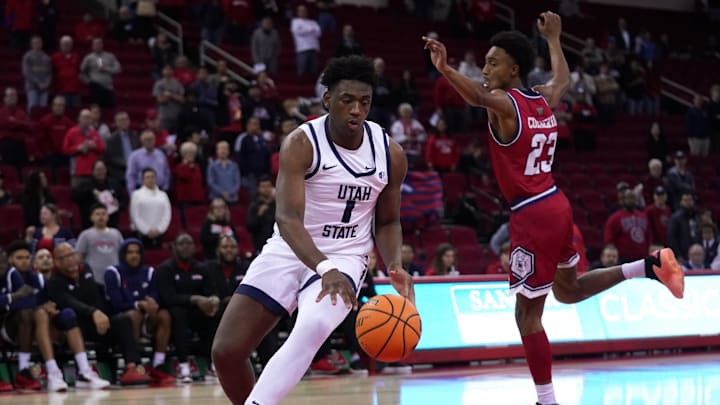 Feb 27, 2024; Fresno, California, USA; Utah State Aggies forward Great Osobor (1) dribbles the ball
