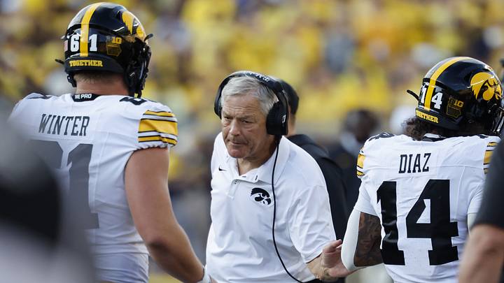 Sep 26, 2026; Ann Arbor, Michigan, USA; Iowa Hawkeyes head coach Kirk Ferentz reacts with wide receiver Tony Diaz (14) and offensive line Cael Winter (61) during the second half against the Michigan Wolverines at Michigan Stadium. Mandatory Credit: Rick Osentoski-Imagn Images Sep 26, 2026; Ann Arbor, Michigan, USA; Iowa Hawkeyes head coach Kirk Ferentz reacts with wide receiver Tony Diaz (14) and offensive line Cael Winter (61) during the second half against the Michigan Wolverines at Michigan Stadium. Mandatory Credit: Rick Osentoski-Imagn Images