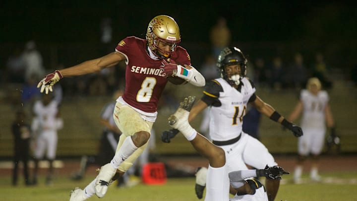 Florida High junior Micahi Danzy (8) leaps through the air in the Class 2S state semifinal matchup between Florida High and Bishop Verot on Dec. 2, 2022, at Mike Hickman Stadium. The Seminoles won, 38-28.

J9t8323