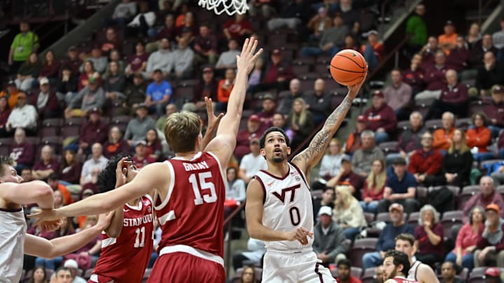 Jan 7, 2026; Blacksburg, Va.; Virginia Tech guard Jailen Bedford (0) lays the ball up as Stanford forward Oskar Giltay (15) defends.