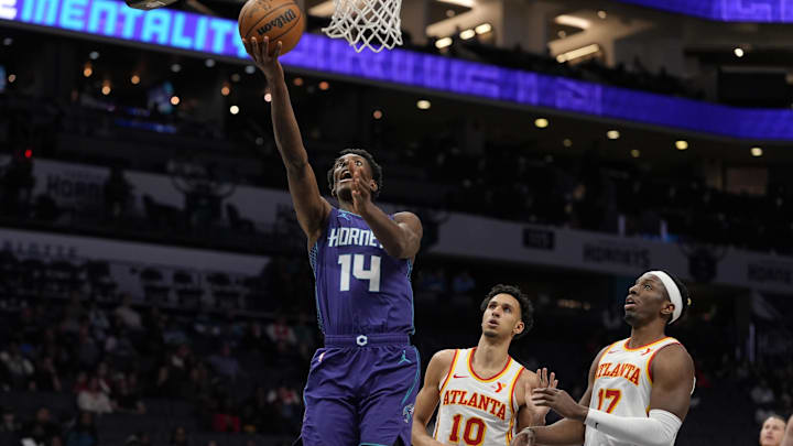 Mar 18, 2025; Charlotte, North Carolina, USA; Charlotte Hornets forward Moussa Diabate (14) drives to the basket against the Atlanta Hawks during second half at Spectrum Center. Mandatory Credit: Jim Dedmon-Imagn Images